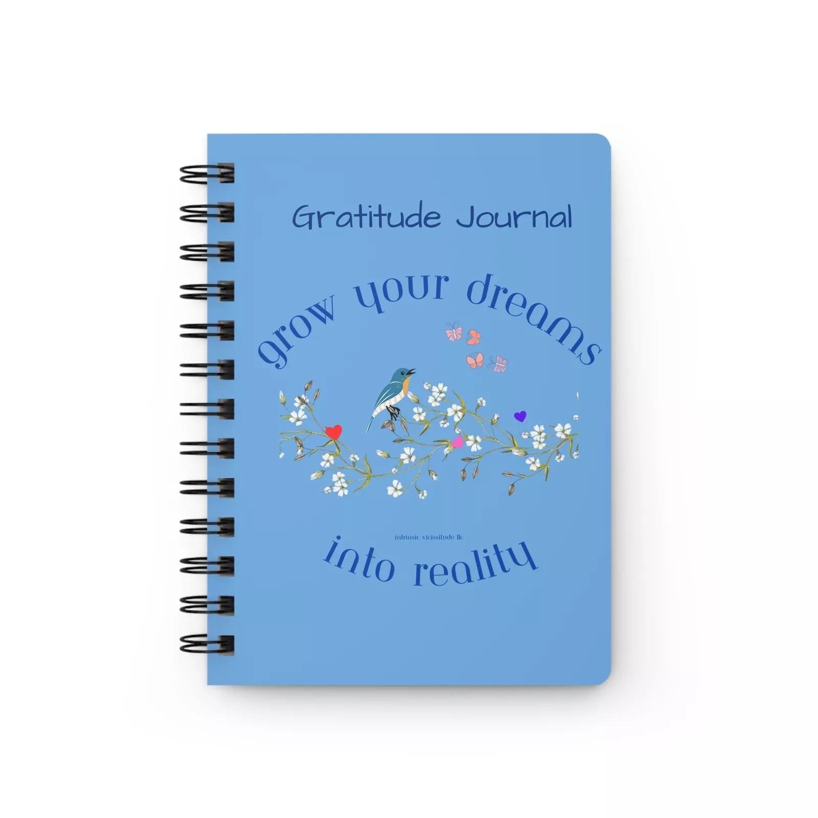 Gratitude journal in blue with birds and flowers on the cover