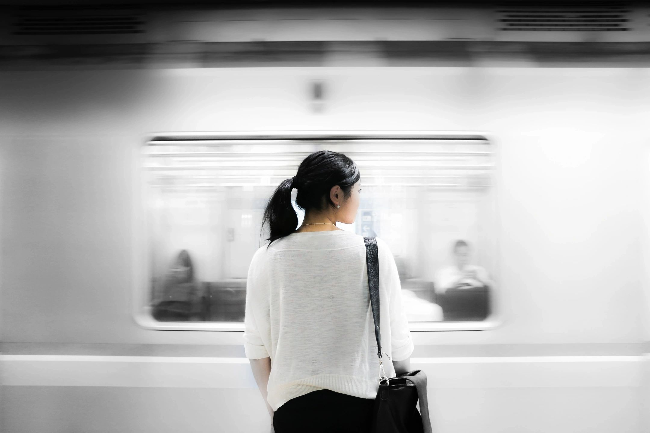 Woman waiting on a train - sense of purpose