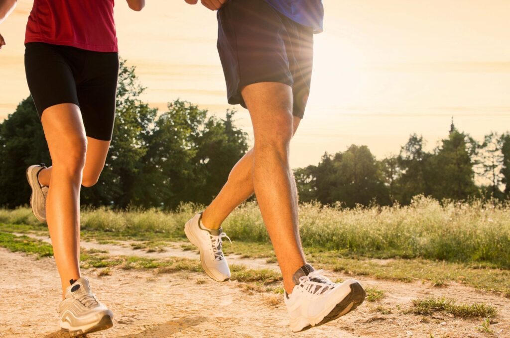 Two pairs of feet on a rural path for motivation struggle ideas