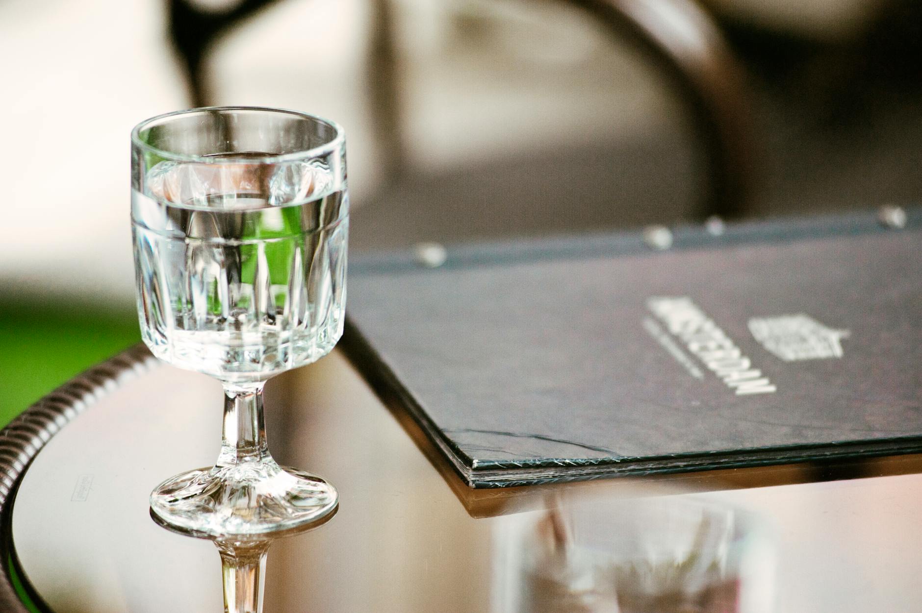 clear short stemmed glass on round tabletop