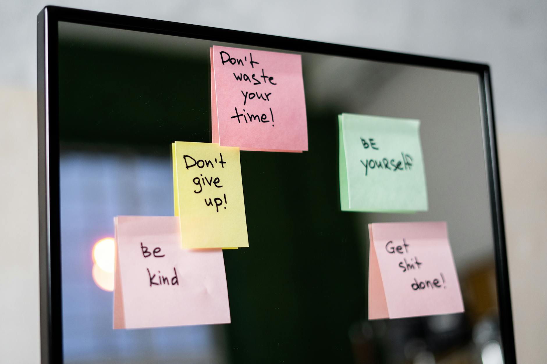 sticky notes on glass wall