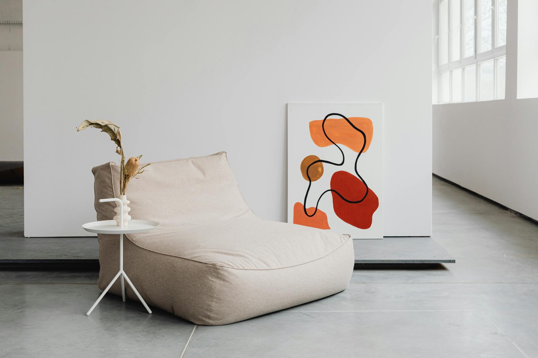 sofa near table and painting