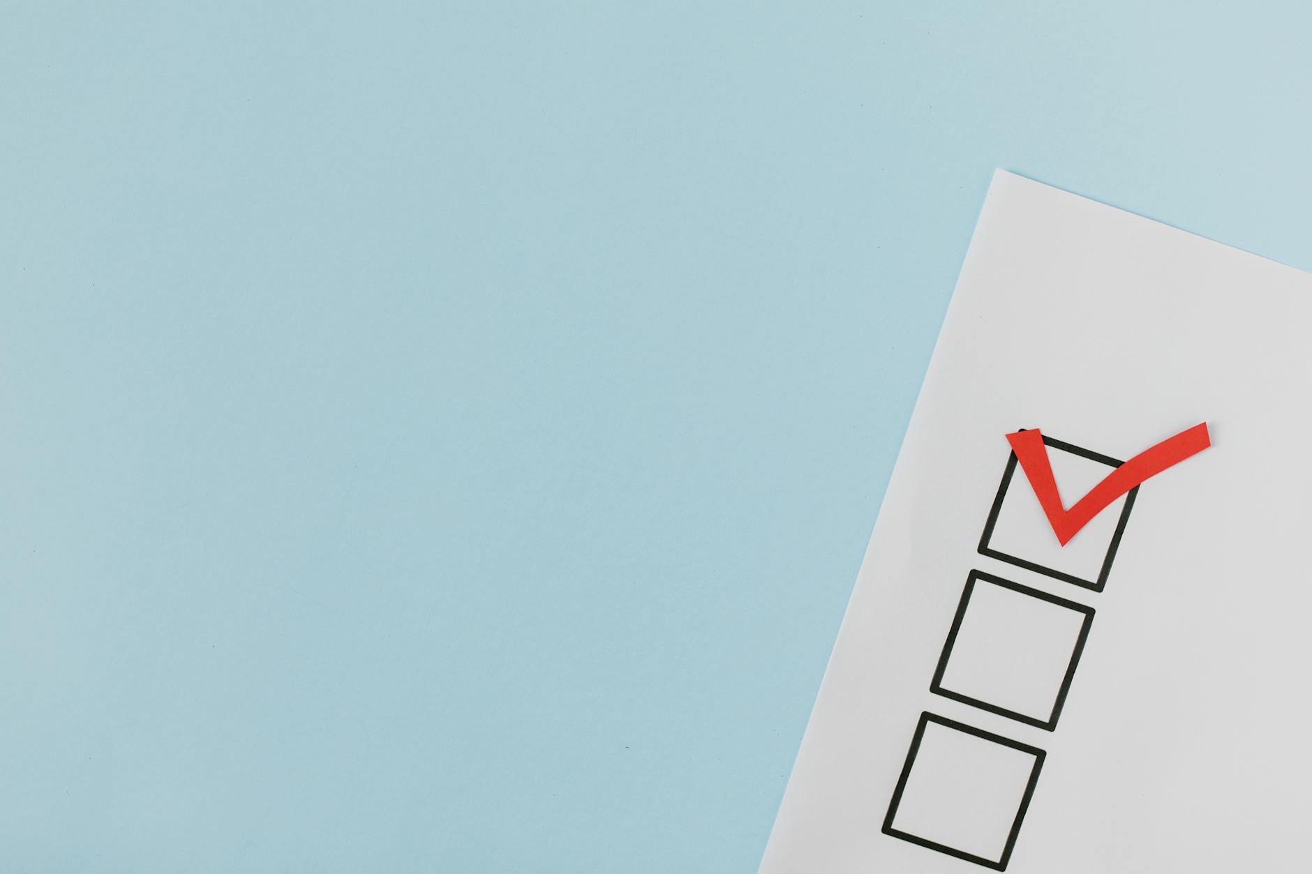 red check mark on box in close up view - monthly wellness check ins