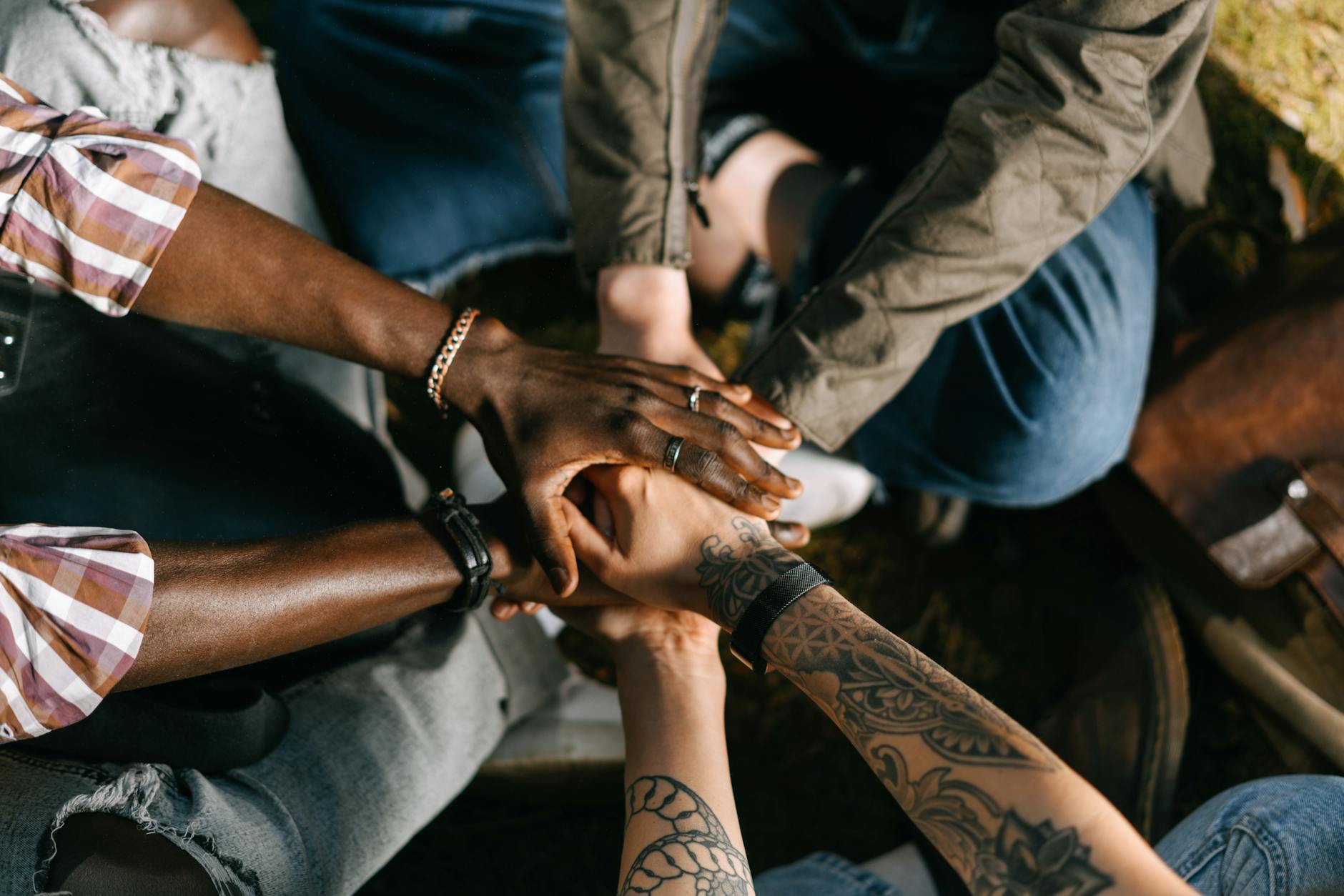 people with their hands together - wellness support system