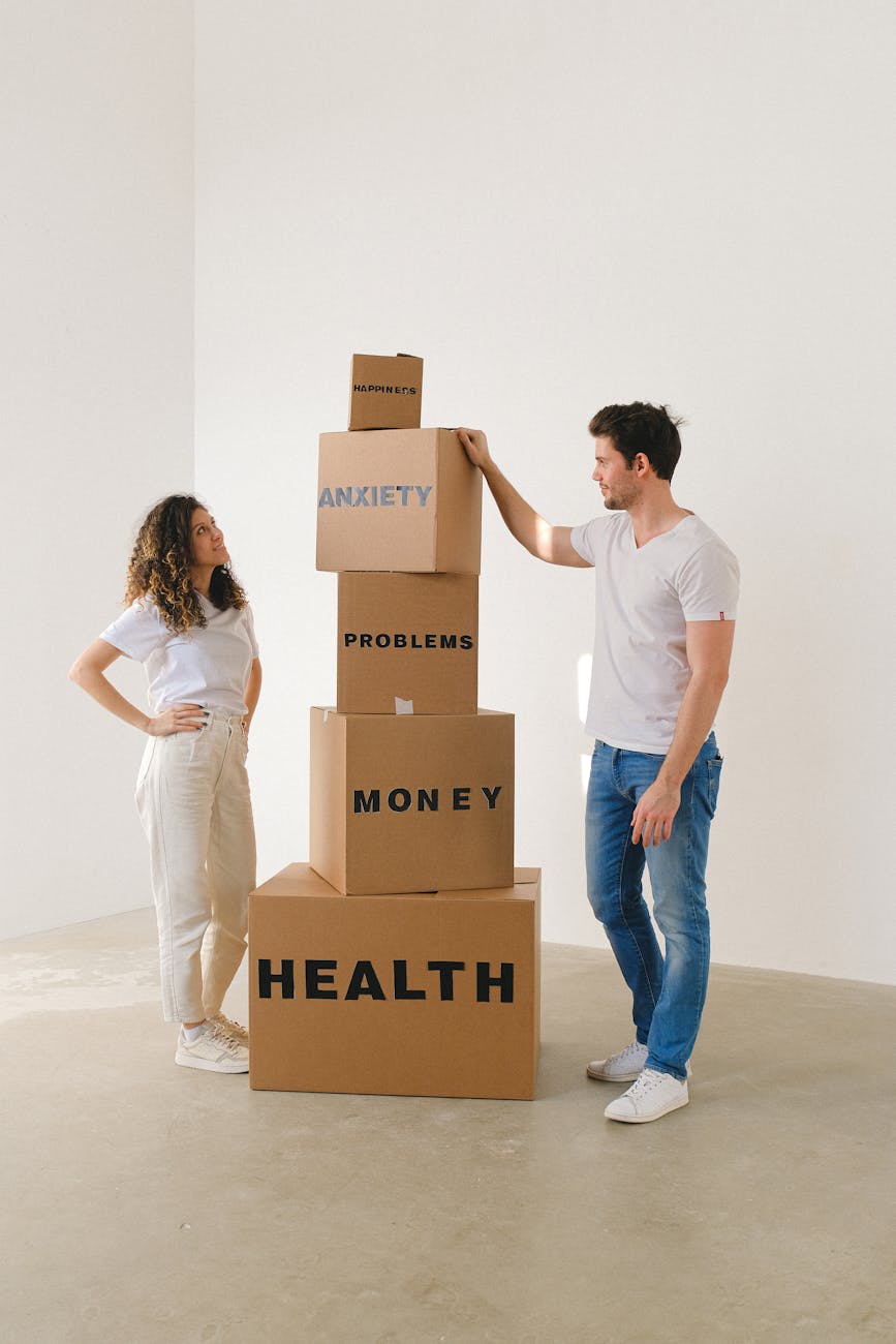 man and woman standing near boxes with labels
