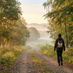 Person taking a calm morning walk, illustrating daily habits for mental resilience
